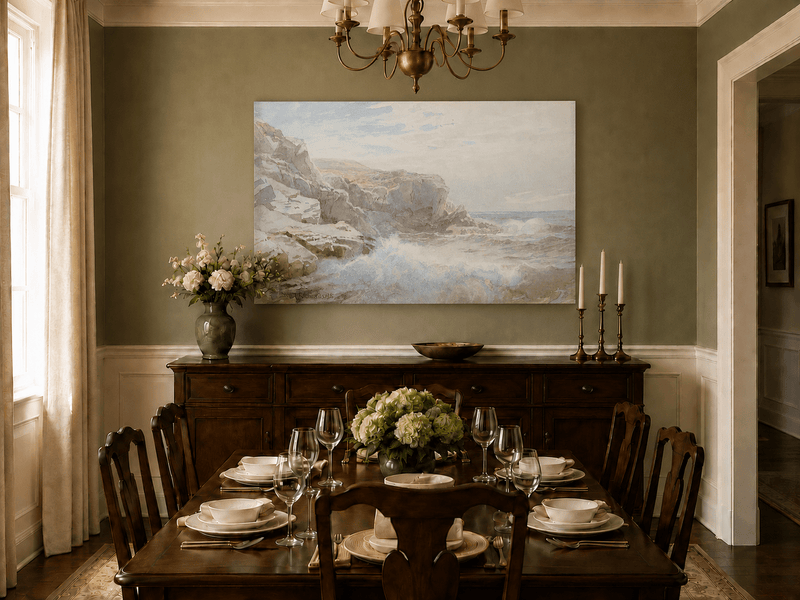 Unframed hand-painted coastal cliffs oil painting with waves breaking along the rocky shore displayed above a formal dining table.