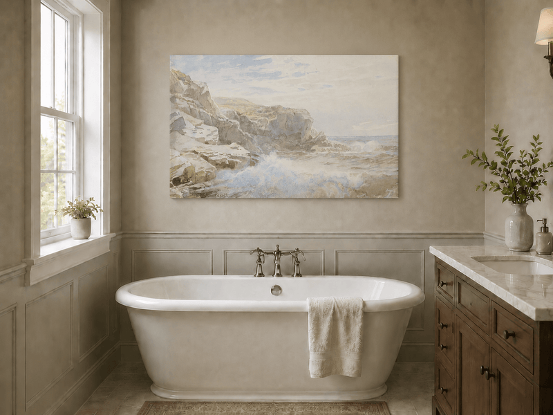 Unframed hand-painted coastal cliffs oil painting with waves breaking along the rocky shore displayed above a freestanding bathtub.