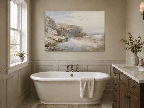 Unframed hand-painted coastal cliffs oil painting with waves crashing against pale rocks displayed above a freestanding bathtub.