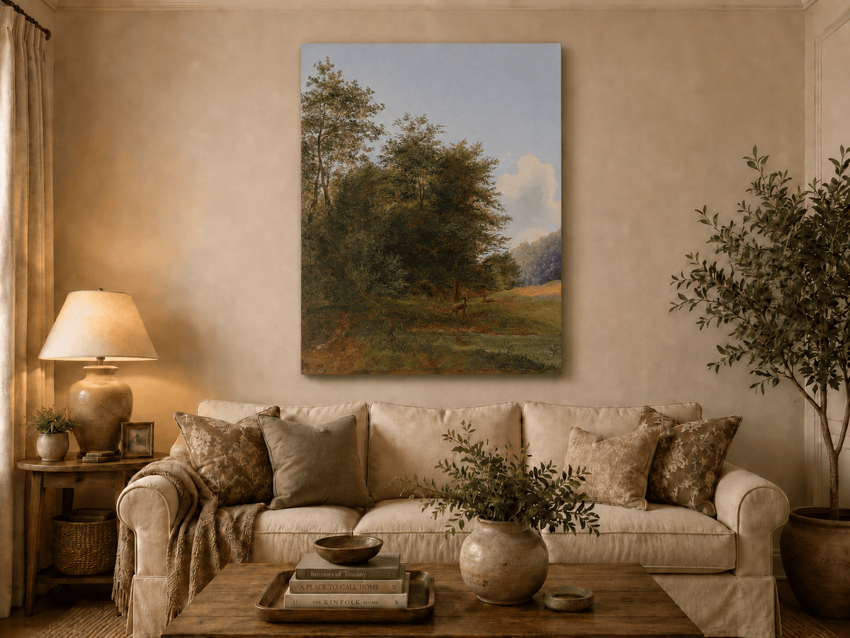 Hand-painted deer by a quiet forest pond landscape oil painting displayed above a sofa in a living room interior.