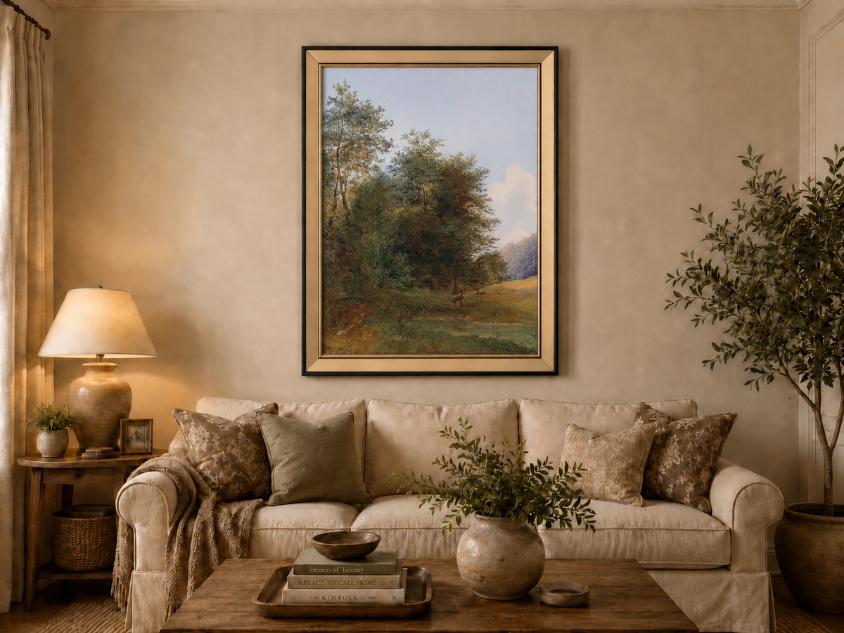 Hand-painted deer by a quiet forest pond landscape oil painting displayed above a sofa in a living room interior.