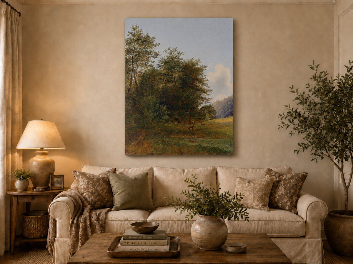Hand-painted deer by a quiet forest pond landscape oil painting displayed above a sofa in a living room interior.