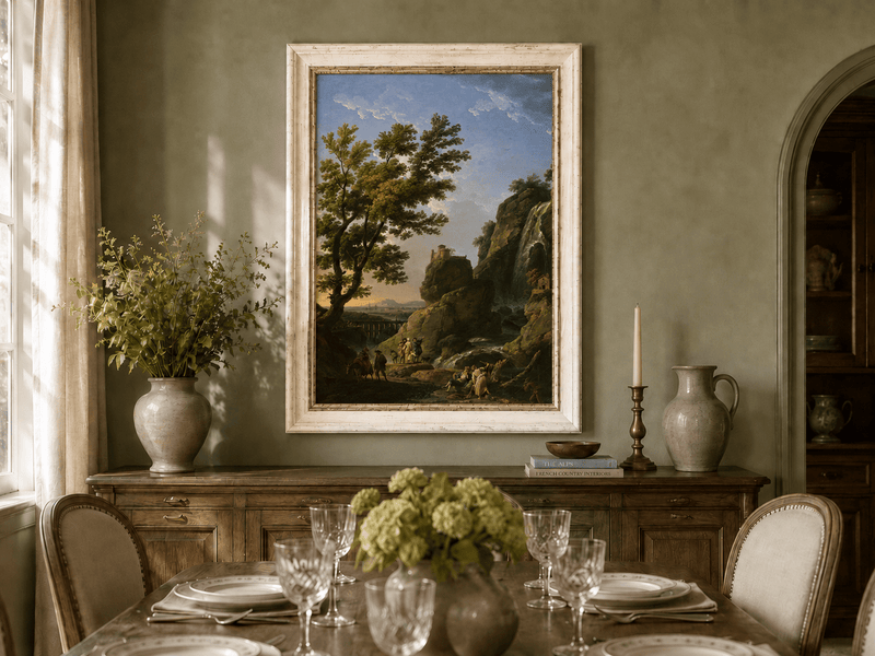 Cliffside castle and waterfall oil landscape artwork shown in a styled home interior.