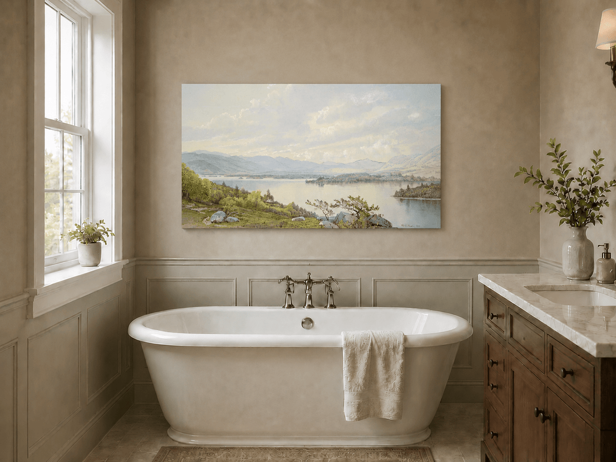 Unframed hand-painted expansive lake oil painting with distant mountains, trees and calm water displayed above a freestanding bathtub.