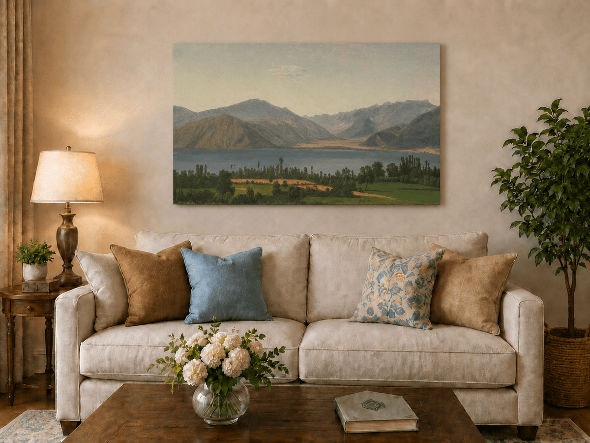 Hand-painted Lake Fucino and Abruzzi Mountains landscape oil painting displayed above a sofa in a living room interior.