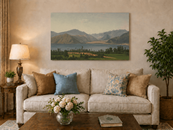 Hand-painted Lake Fucino and Abruzzi Mountains landscape oil painting displayed above a sofa in a living room interior.