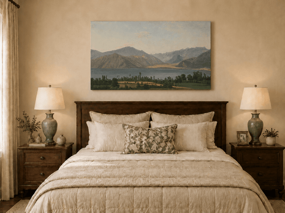 Hand-painted Lake Fucino and Abruzzi Mountains landscape oil painting displayed above a bed in a bedroom interior.