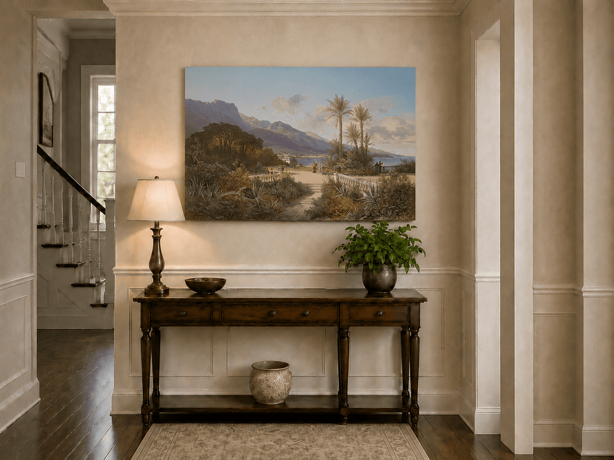 Hand-painted Mediterranean coastal garden with peaks and figures landscape oil painting displayed above a console table in a hallway interior.