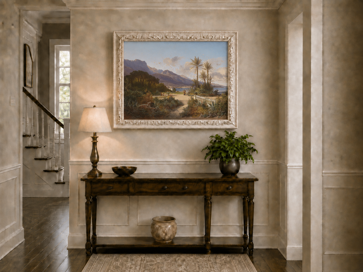 Hand-painted Mediterranean coastal garden with peaks and figures landscape oil painting displayed above a console table in a hallway interior.