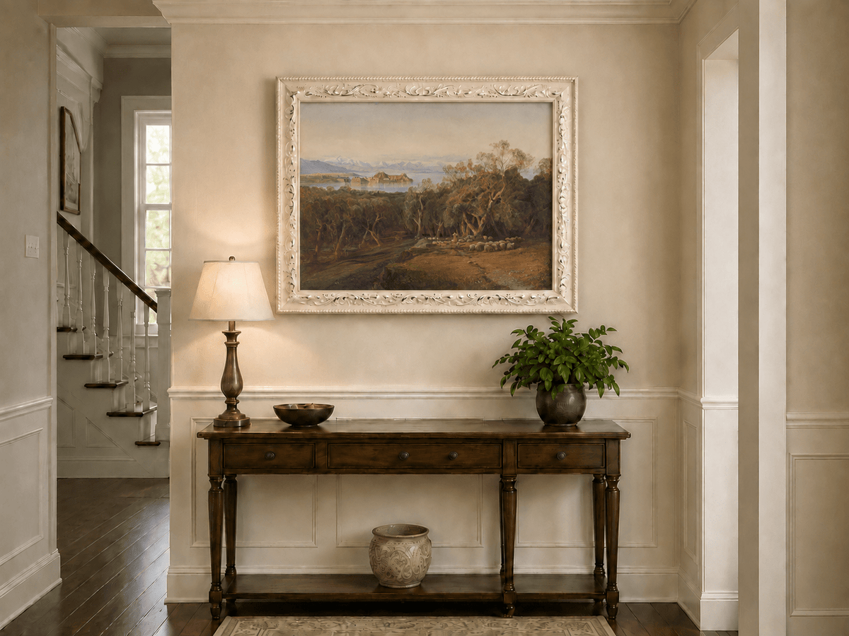 Hand-painted Mediterranean coastal island fortress landscape oil painting displayed above a console table in a hallway interior.