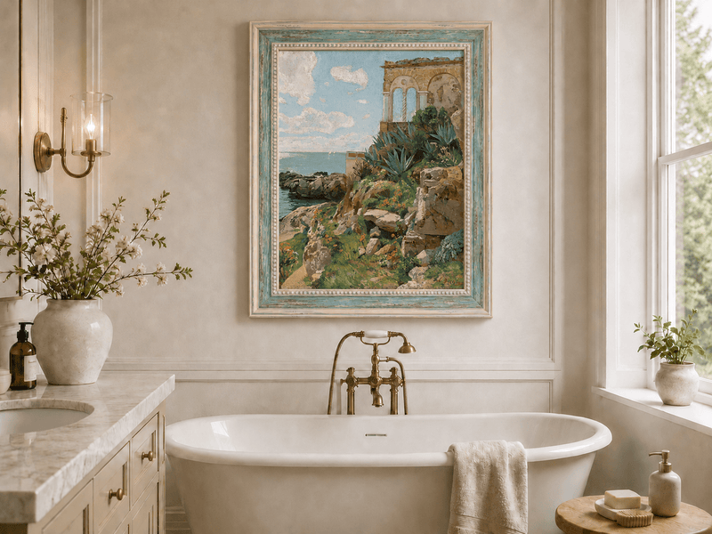 Hand-painted Mediterranean coastal ruins with arch and succulents landscape oil painting displayed in a bathroom interior above a bathtub.