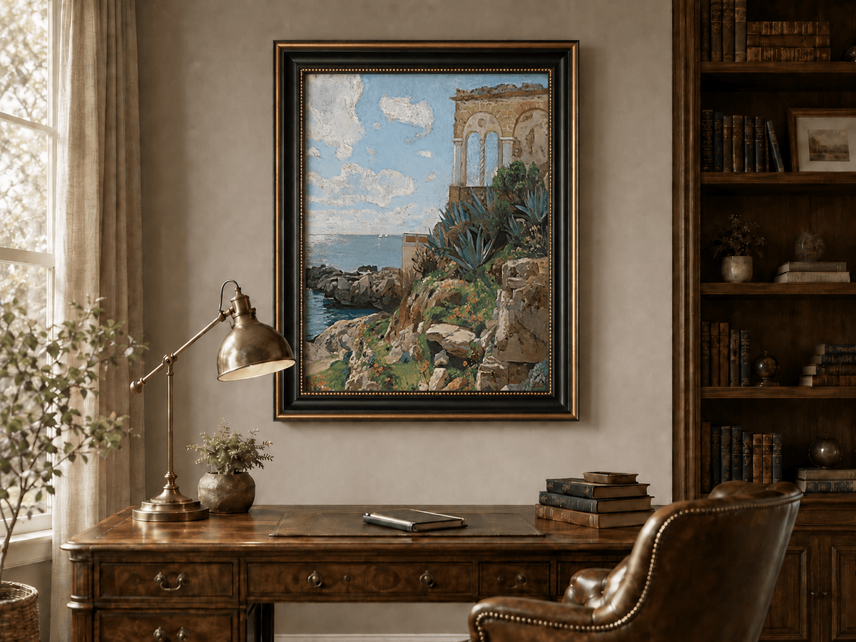 Hand-painted Mediterranean coastal ruins with arch and succulents landscape oil painting displayed above a desk in a home office interior.