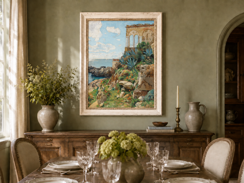 Hand-painted Mediterranean coastal ruins with arch and succulents landscape oil painting displayed in a dining room interior.