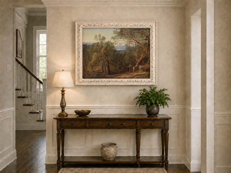 Hand-painted Mediterranean woodland, bay, fortress and figures landscape oil painting displayed above a console table in a hallway interior.