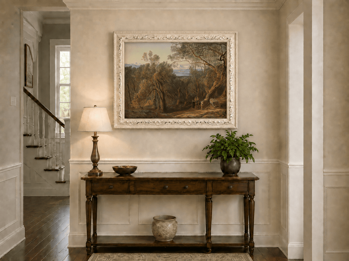 Hand-painted Mediterranean woodland, bay, fortress and figures landscape oil painting displayed above a console table in a hallway interior.