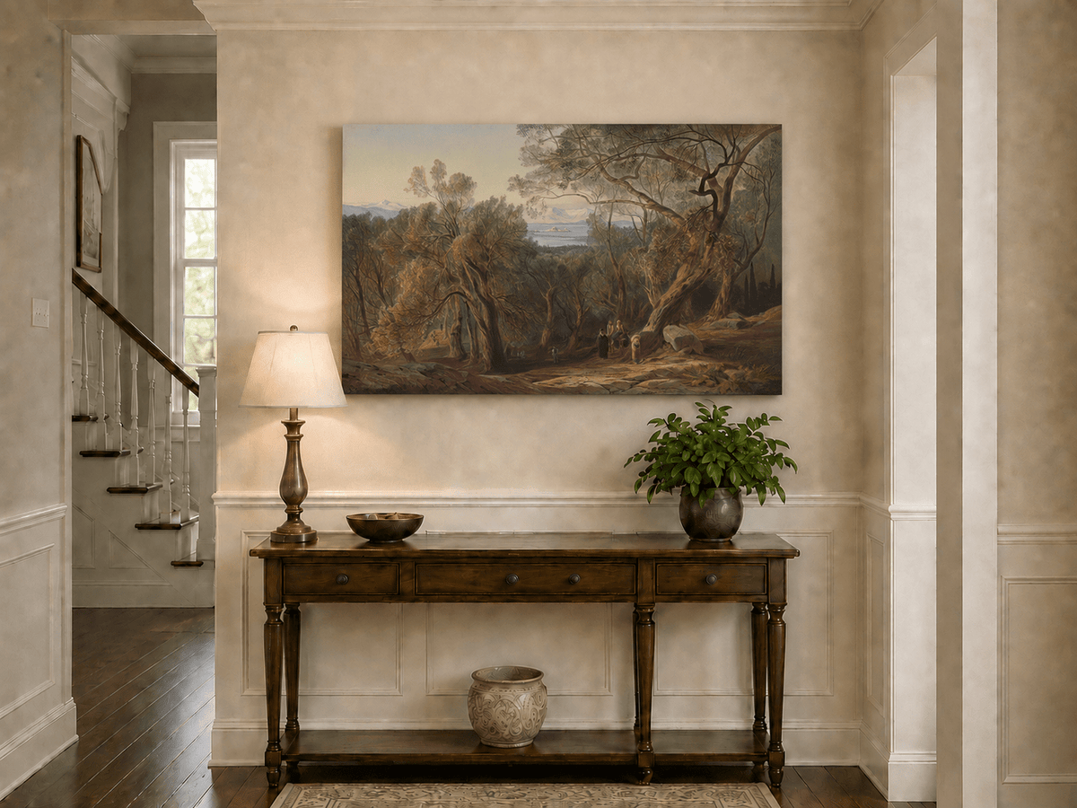 Hand-painted Mediterranean woodland, bay, fortress and figures landscape oil painting displayed above a console table in a hallway interior.
