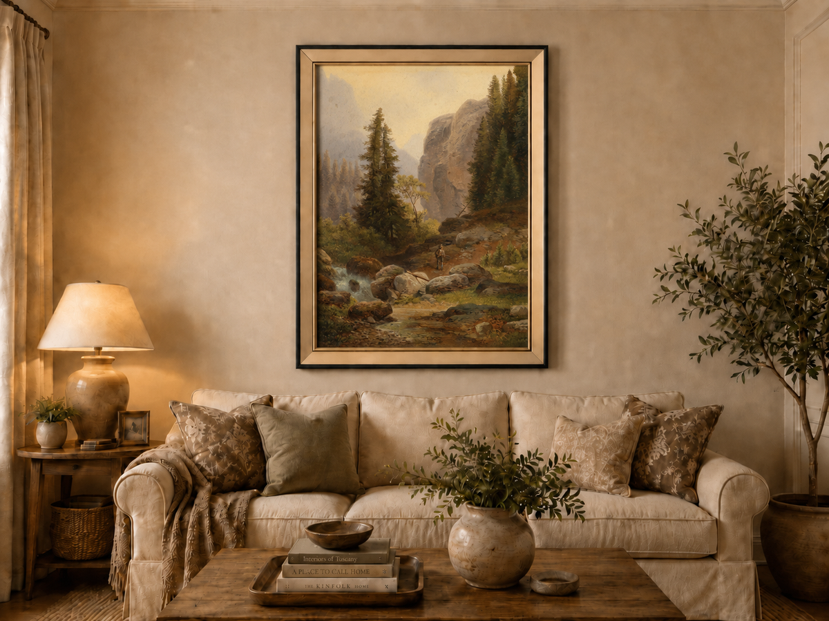 Hand-painted mountain gorge, stream and pine-filled rocks landscape oil painting displayed above a sofa in a living room interior.