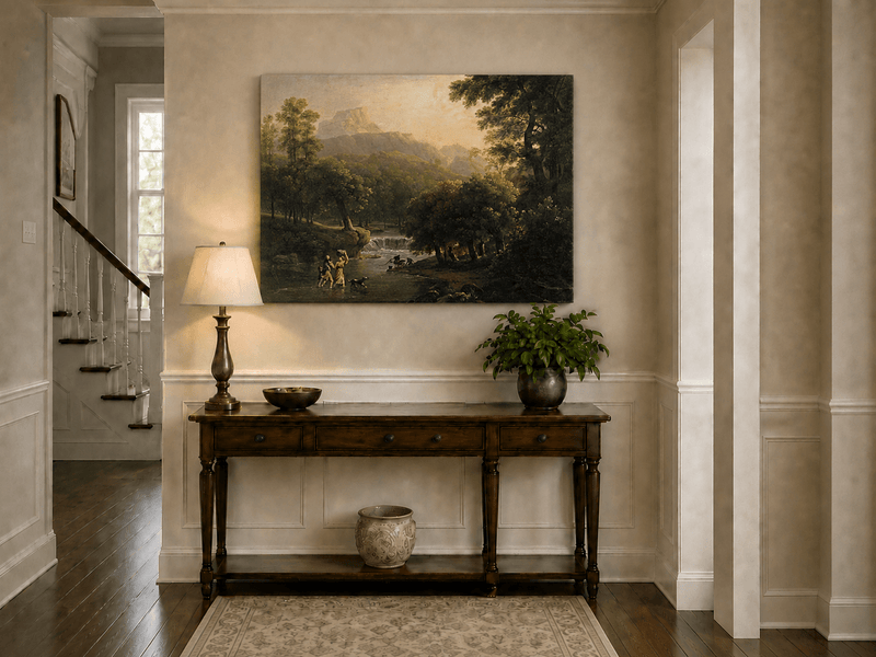 Hand-painted mountain stream with figures at dawn landscape oil painting displayed above a console table in a hallway interior.