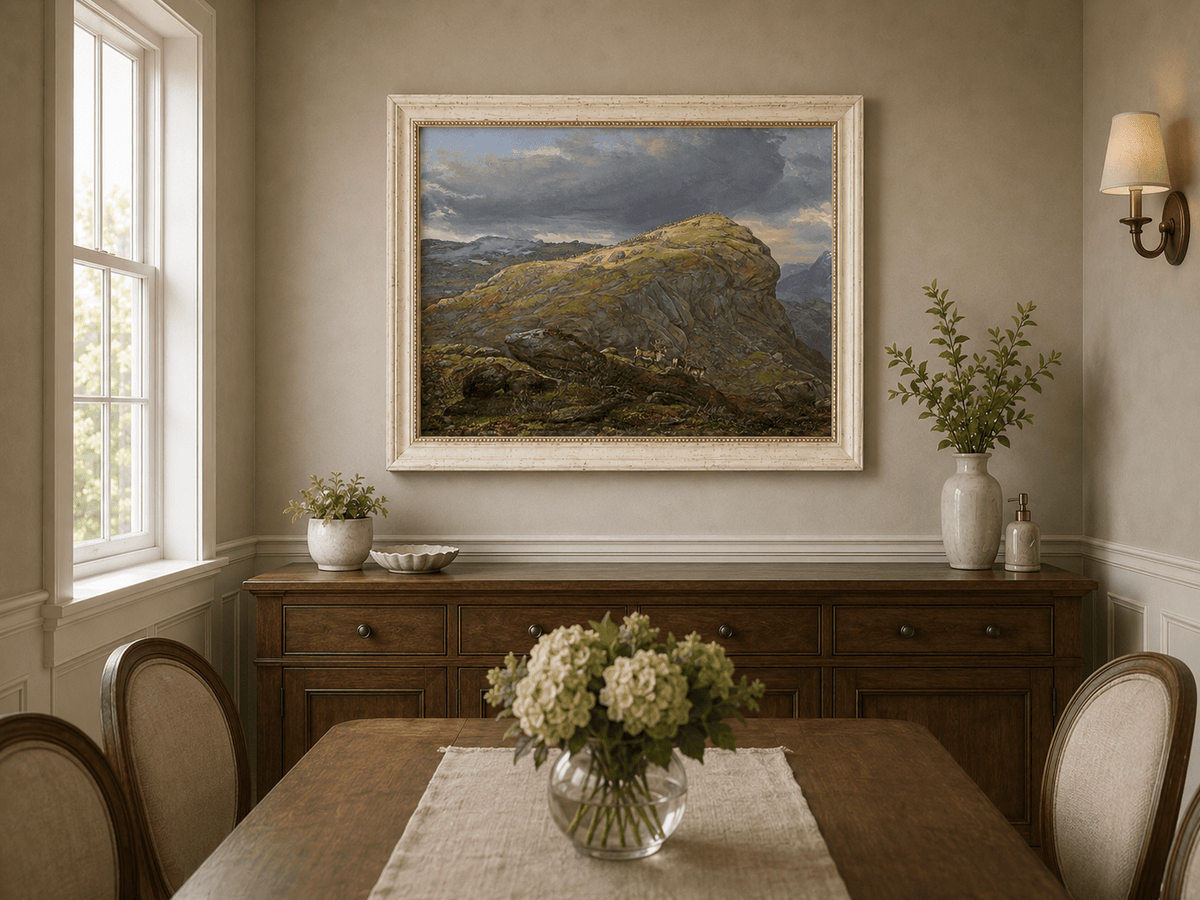 Mountain top and reindeer oil landscape artwork shown in a styled home interior.