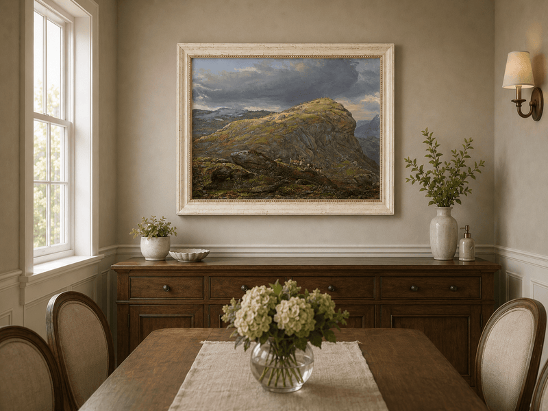 Mountain top and reindeer oil landscape artwork shown in a styled home interior.
