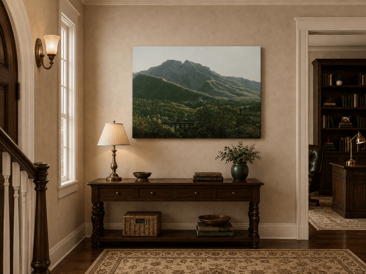 Hand-painted mountain view with bridge and greenery landscape oil painting displayed above a console table in a hallway interior.