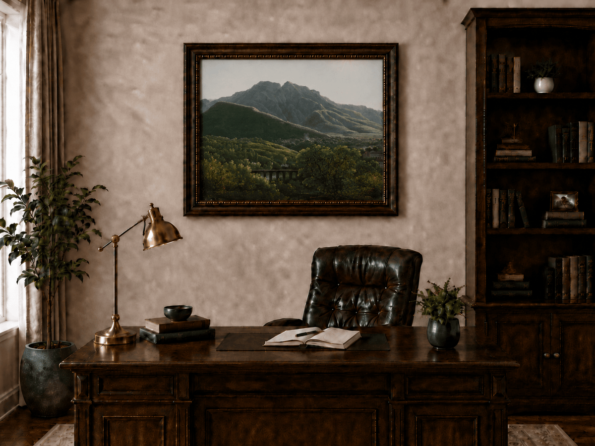 Hand-painted mountain view with bridge and greenery landscape oil painting displayed above a desk in a home office interior.