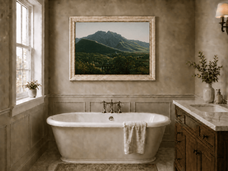 Hand-painted mountain view with bridge and greenery landscape oil painting displayed in a bathroom interior above a bathtub.