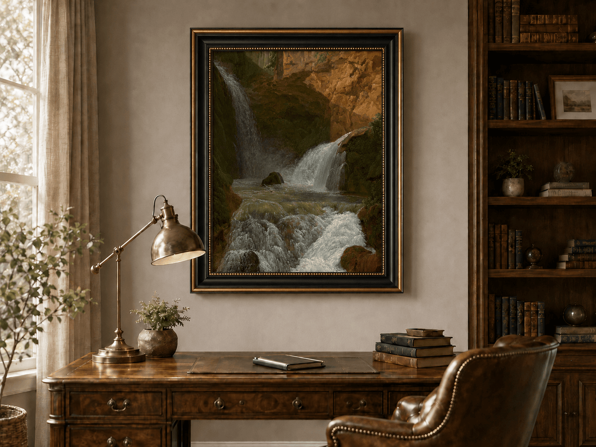Hand-painted mountain waterfall in a rocky gorge landscape oil painting displayed above a desk in a home office interior.