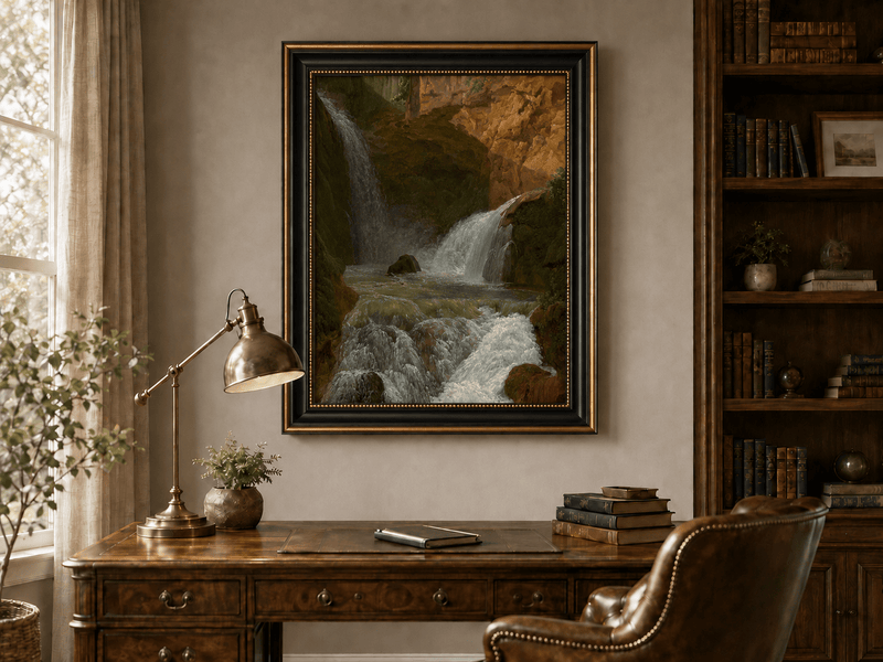 Hand-painted mountain waterfall in a rocky gorge landscape oil painting displayed above a desk in a home office interior.