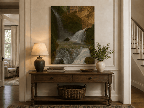 Hand-painted mountain waterfall in a rocky gorge landscape oil painting displayed above a console table in a hallway interior.