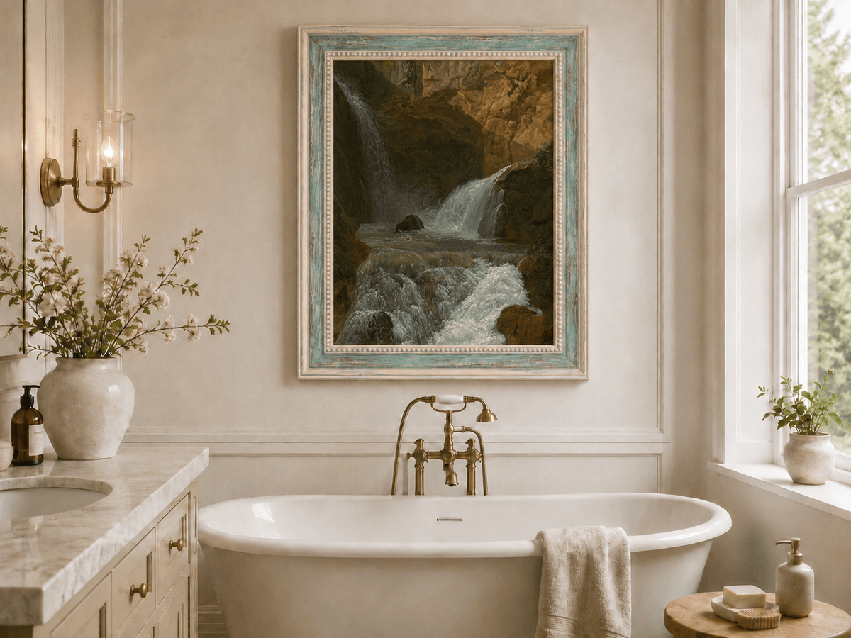 Hand-painted mountain waterfall in a rocky gorge landscape oil painting displayed in a bathroom interior above a bathtub.
