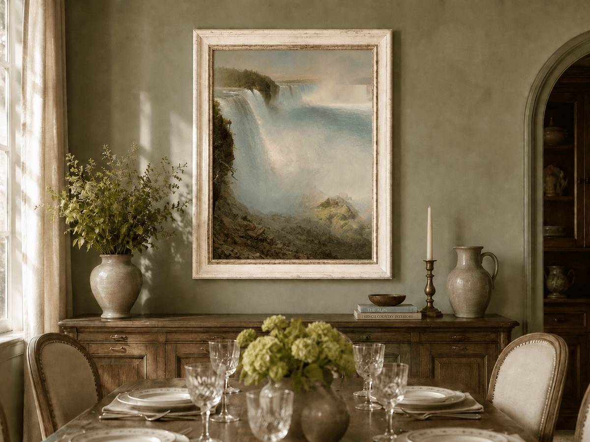 Niagara Falls and rushing water oil landscape artwork shown in a styled home interior.