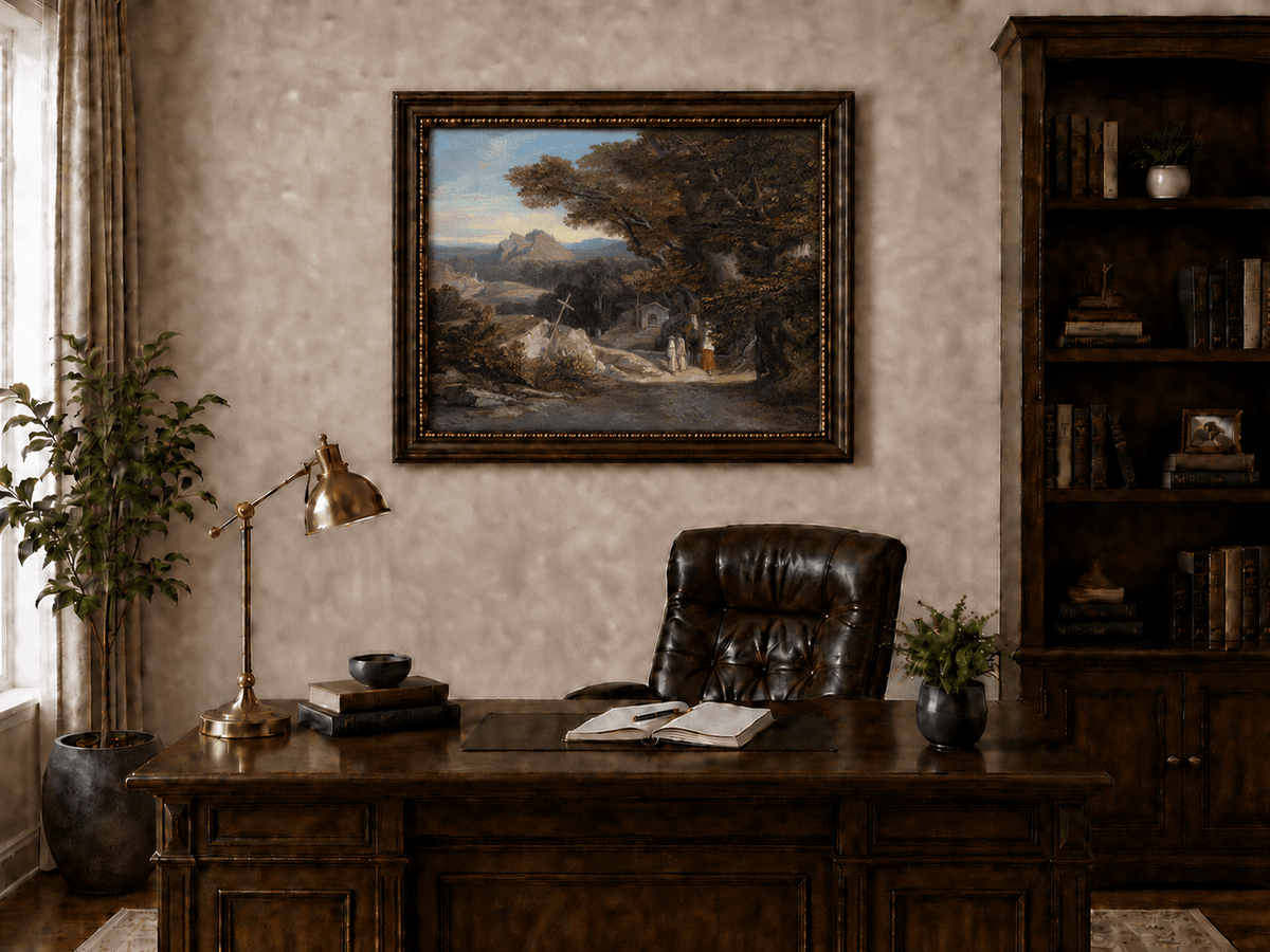 Hand-painted path with figures, cross and distant mountain peaks landscape oil painting displayed above a desk in a home office interior.