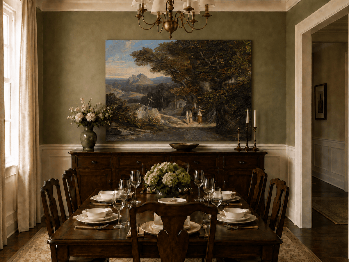Hand-painted path with figures, cross and distant mountain peaks landscape oil painting displayed above a sofa in a living room interior.