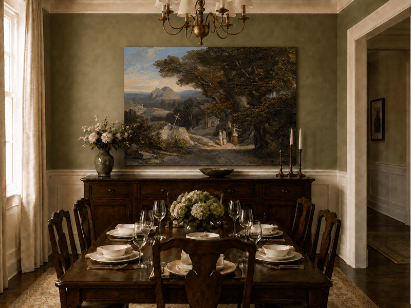 Hand-painted path with figures, cross and distant mountain peaks landscape oil painting displayed above a sofa in a living room interior.