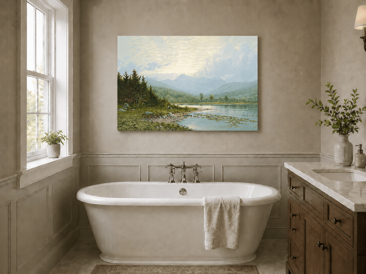 Unframed hand-painted lake shore oil painting with pine shade, still water and mountain peaks displayed above a freestanding bathtub.