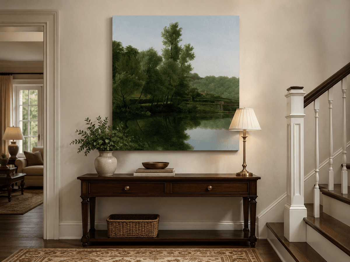 Hand-painted quiet riverside trees and reflections landscape oil painting displayed above a console table in a hallway interior.
