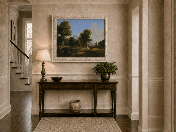 Hand-painted riverside grove with classical figures landscape oil painting displayed above a console table in a hallway interior.