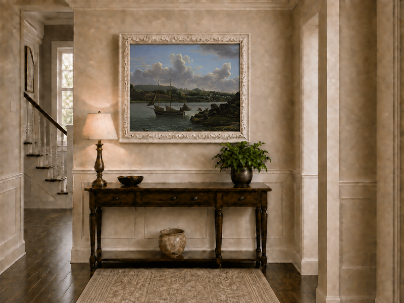 Hand-painted riverside sailboat with figures, dogs and distant hills landscape oil painting displayed above a console table in a hallway interior.