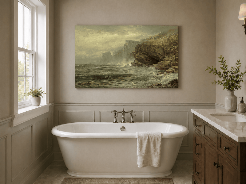 Unframed hand-painted rocky seaside oil painting with churning waves and misty cliffs displayed above a freestanding bathtub.