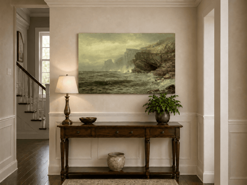 Unframed hand-painted rocky seaside oil painting with churning waves and misty cliffs displayed above an entryway console table.