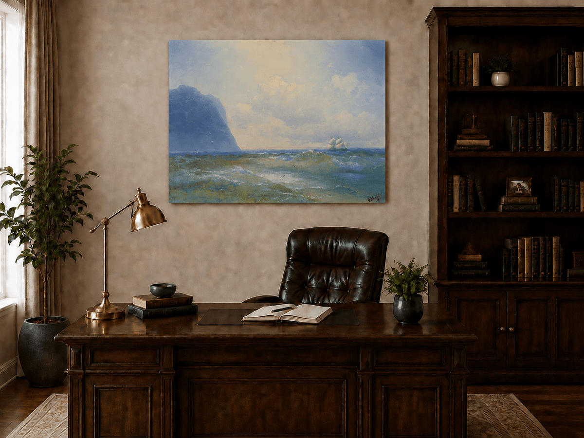 Hand-painted sailing beyond the blue cliff seascape oil painting displayed above a desk in a home office interior.