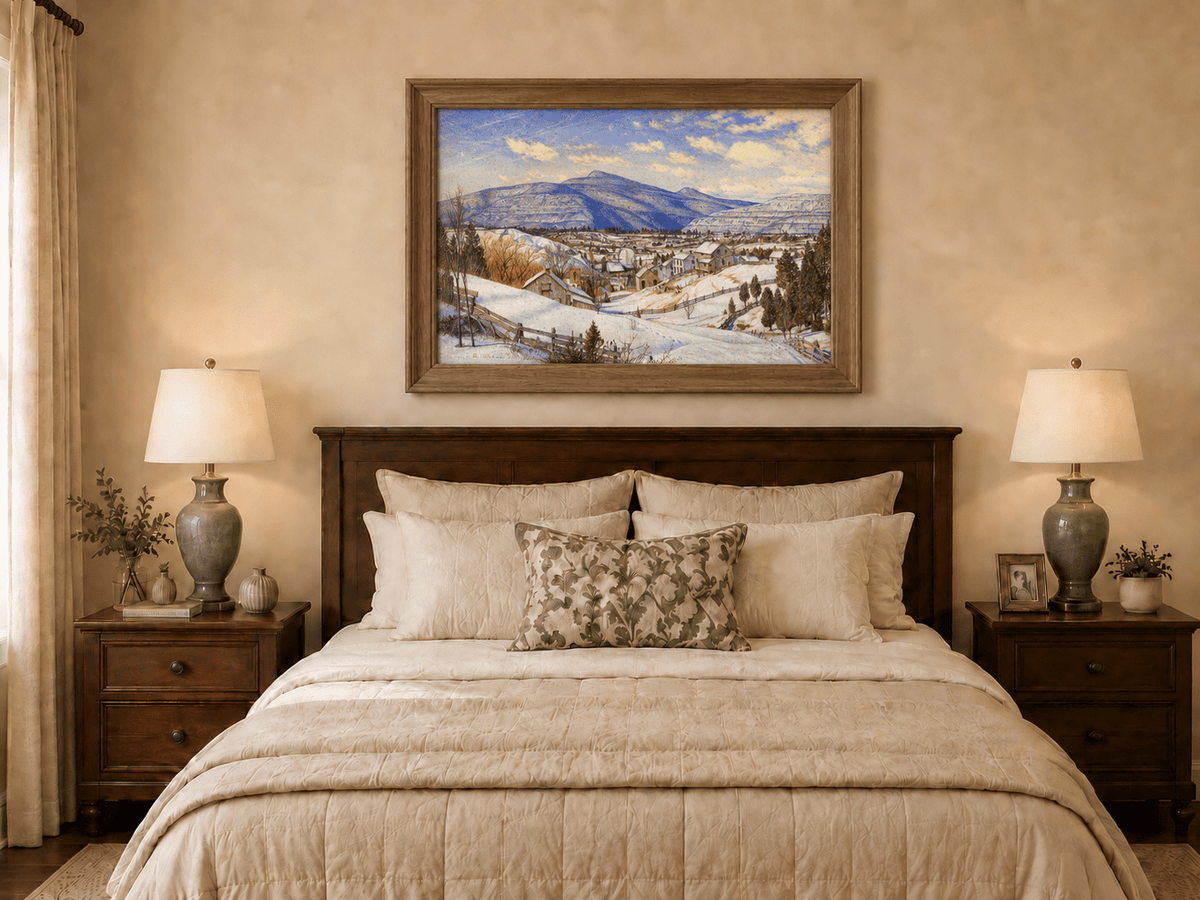 Hand-painted Snowy Mountain Village in Winter Light landscape oil painting displayed as wall art in a styled interior