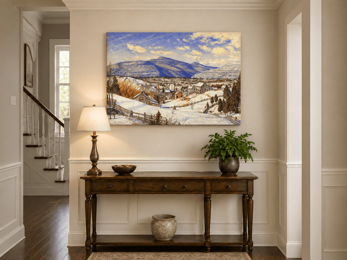 Hand-painted Snowy Mountain Village in Winter Light landscape oil painting displayed as wall art in a styled interior