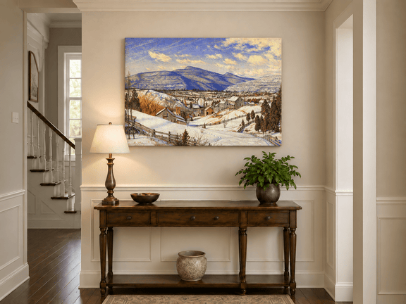 Hand-painted Snowy Mountain Village in Winter Light landscape oil painting displayed as wall art in a styled interior
