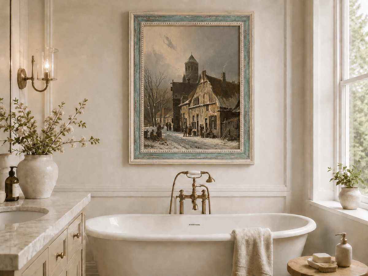 Snowy town street with figures and old buildings oil landscape artwork shown in a styled home interior.