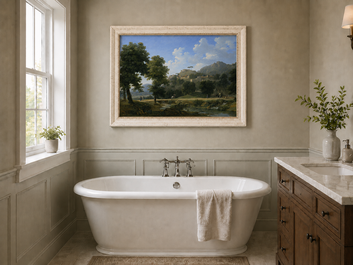 Hand-painted sunlit hill village and river view landscape oil painting displayed in a bathroom interior above a bathtub.