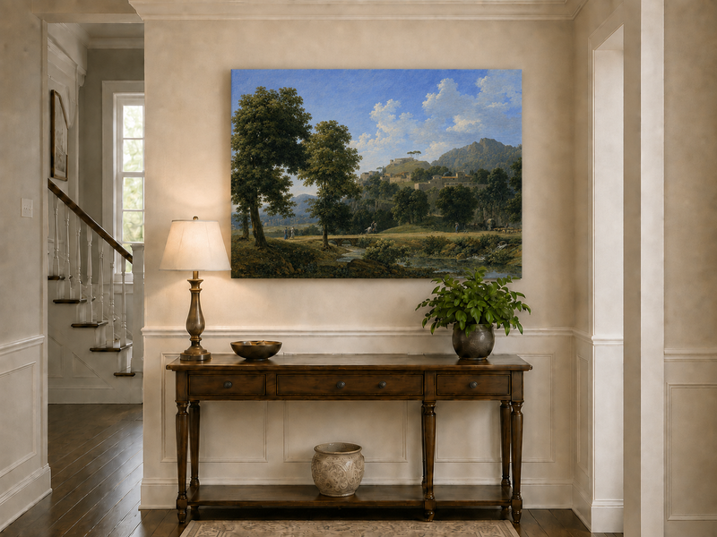 Hand-painted sunlit hill village and river view landscape oil painting displayed above a console table in a hallway interior.