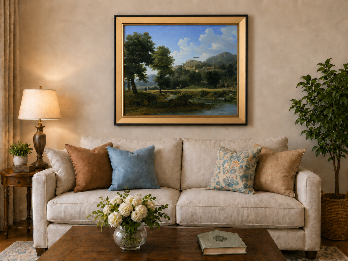 Hand-painted sunlit hill village and river view landscape oil painting displayed above a sofa in a living room interior.