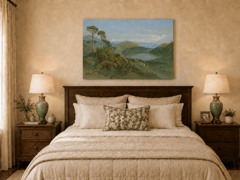 Unframed hand-painted valley lake oil painting with tall pines, a blue bay and green hills displayed above a wooden bed in a neutral bedroom.